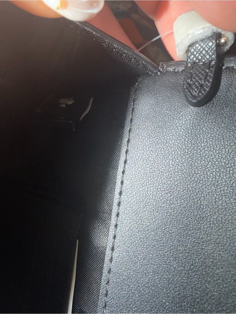 kate spade black saffiano leather flap wallet with gold plaque